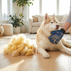 Owner using Paw Crate deshedding mitt on husky with large fur pile result