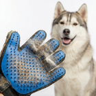 Close up of Paw Crate deshedding mitt with collected husky fur